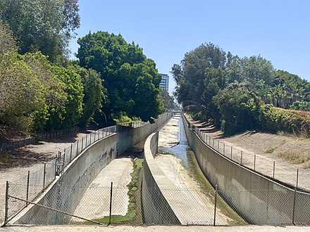 A desolate and depressing storm drain, yes, but also, the north fork of Sepulveda Creek, a major tributary of Ballona Creek, where it emerges from underground at Military Ave. and Queensland St. in the Westdale neighborhood of Los Angeles