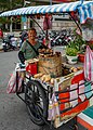 * Nomination Taipei, Taiwan: A hawker offering his Sweet Potatoes in front of Shilin MRT Station --Cccefalon 04:30, 18 February 2016 (UTC) * Promotion Good quality. --Johann Jaritz 04:32, 18 February 2016 (UTC)