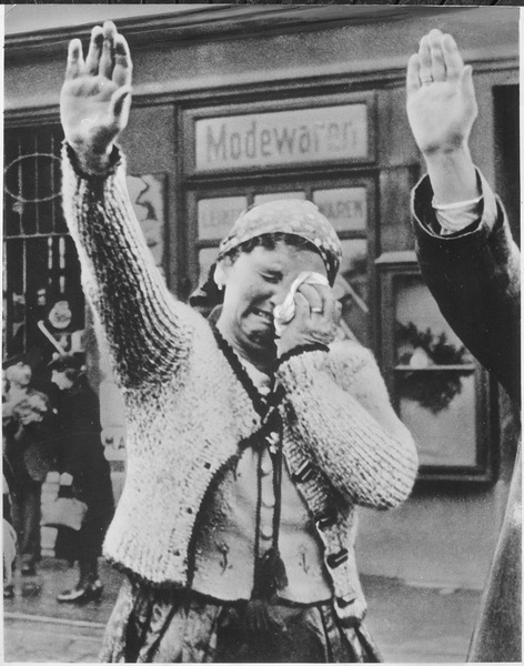 File:The tragedy of this Sudeten woman, unable to conceal her misery as she dutifully salutes the triumphant Hitler, is... - NARA - 535897.tif