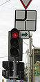 Traffic light with a green sign