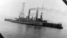 Quail alongside Coast Battleship No. 4 (ex. USS Iowa (BB-4)) off Panama, early 1923. A Pennsylvania-class battleship is in the background. USS Quail (AM-15) - NH 77309.tiff