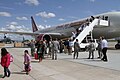 US Navy 110322-N-0640G-044 Family members of military personnel disembark a military-chartered flight from Japan during Operation Pacific Passage,.jpg