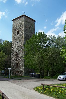 The tower of the moated castle and the castle ruins