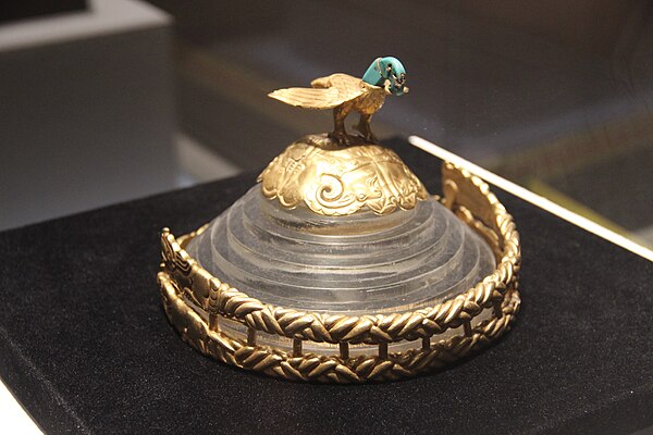 A gold crown belonging to a Xiongnu king, from the early Xiongnu period. Seen at the top of a crown is an eagle with a turquoise head.[63]