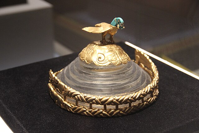 A gold crown belonging to a Xiongnu king, from the early Xiongnu period. Seen at the top of a crown is an eagle with a turquoise head.
