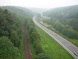 The railway line and motorway in the valley