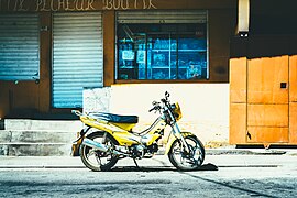 Yellow motorcycle parked (Unsplash).jpg