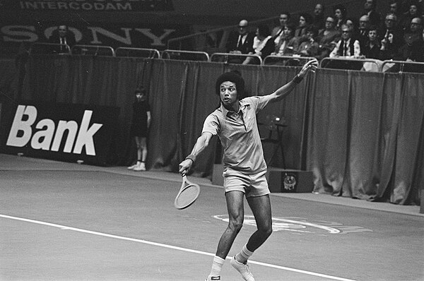 Arthur Ashe (pictured here during the 1975 tournament) holds the joint-record for most singles titles with three wins (1972, 1975–76).