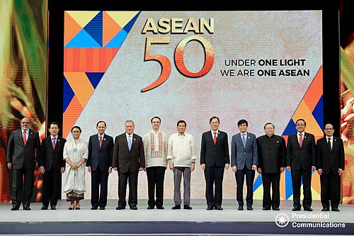 Philippine President Rodrigo Duterte poses for a photo with the ASEAN foreign ministers during the 50th anniversary of the group's foundation on 8 August 2017.