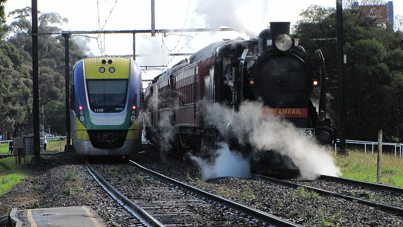 File:A VLine trains passes a steam locomotive at Pakenham.jpg