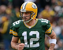 Rodgers from the waist up wearing his football uniform