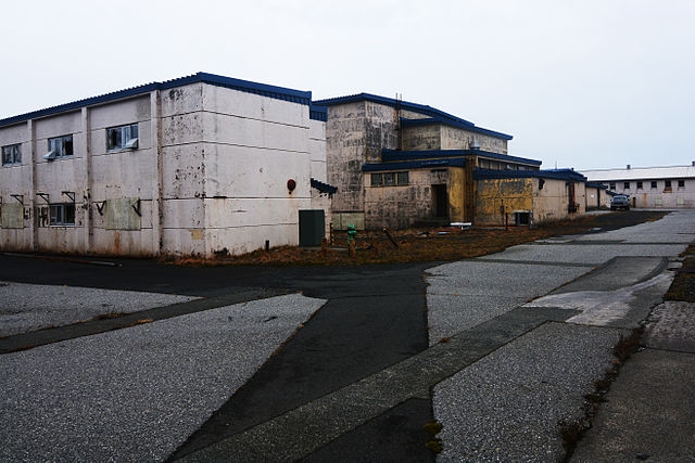Abandoned military buildings on Adak Island. These buildings house a basketball court, squash court, saunas, bowling alley, and more, all in an unusab
