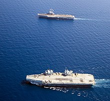 Charles de Gaulle (top) operating with HMS Queen Elizabeth in the Mediterranean Sea in 2021 Aircraft carriers HMS Queen Elizabeth (R08) and Charles de Gaulle (R91) underway in the Mediterranean Sea on 3 June 2021 (210603-M-MS099-336).JPG