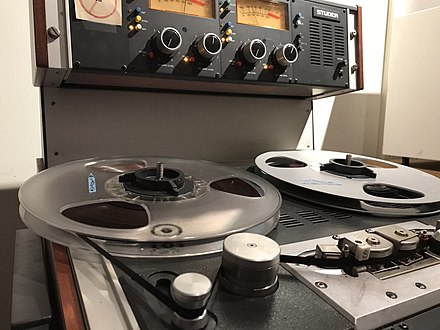 1/4" analog tape being played back on a Studer A810 tape machine for digitization at Smithsonian Folkways Recordings