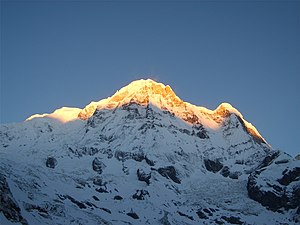 Moditse in the middle of the picture, on the left Annapurna South (central peak)