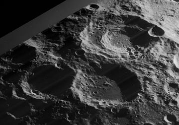 Oblique view of craters Boussingault (above right), Helmholtz (below right), and Neumayer (below left, mostly in shadow), facing southwest, from Lunar Orbiter 4 Boussingault Helmholtz Neumayer craters 4178 h3.jpg