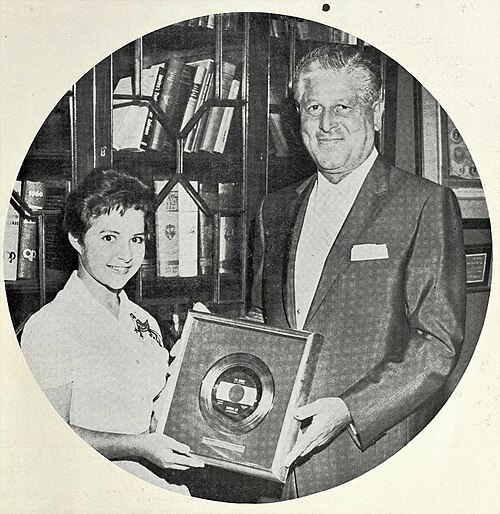 Lee presented with a Gold record for "I'm Sorry", cover of Cash Box, August 27, 1960