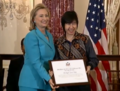 Tan receiving the award from Secretary of State Clinton