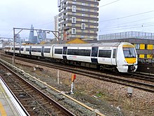 C2C train passing Shadwell (13228298015).jpg