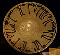 Calligraphic plate, Iraq, Abbasid period, 10th century AD, earthenware with black and green painting over opaque white glaze - Cincinnati Art Museum - DSC04201.JPG