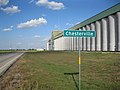 Sign on FM 1093 with grain elevator as backdrop