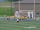 A Detroit player takes a free kick from close range