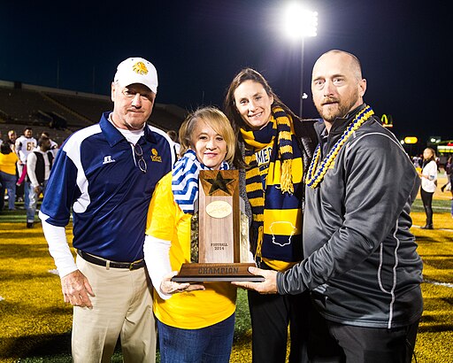 Don and Colby Carthel with family after 2014 Texas A&M-Commerce homecoming
