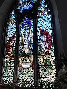 The East Window is dedicated to the dead from the village in the two World Wars East Window St Helen North Thoresby.jpg