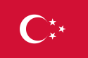 Bendera merah dengan tiga bulan sabit putih, setiap bulan sabit berisi lima bintang putih.