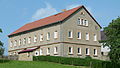 Residential stable house and northern barn of a three-sided courtyard