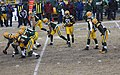 Green Bay Packers offensive players lined up for quarterback w:Matt Flynn (second from right) against the Pittsburgh Steelers. The rightmost player is #27 Eddie Lacy, the leftmost player is center Evan Dietrich Smith, and the player jogging toward the camera in the middle is #81 Andrew Quarless.   This file was uploaded with Commonist.