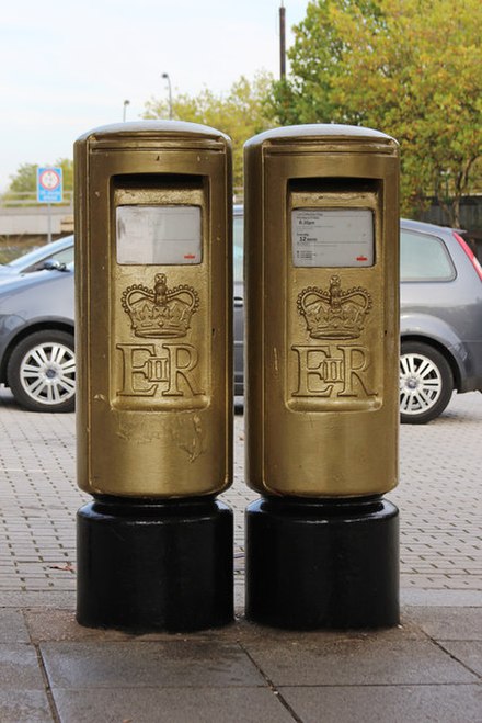 Pair of post boxes in Milton Keynes painted gold in honour of Rutherford