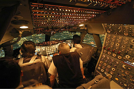 An Iran Air 747-200, showing an early-production 747 cockpit with a flight engineer, located on the upper deck