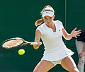 Katie Swan competing in the first round of the 2015 Wimbledon Qualifying Tournament at the Bank of England Sports Grounds in Roehampton, England. The winners of three rounds of competition qualify for the main draw of Wimbledon the following week.