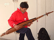 A man playing a kutiyapi, the traditional lute Kutiyapi.jpg