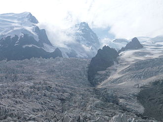 Les Grands Mulets, seen from below, showing the broken state of the Bossons Glacier Les Grands Mulets P1090085.JPG