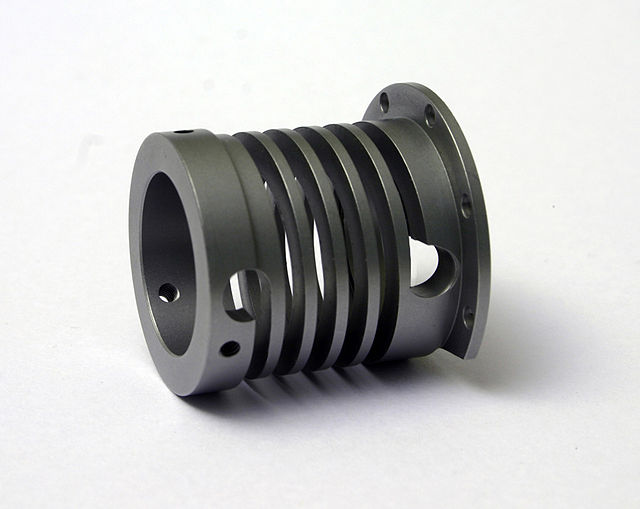A machined spring incorporates several features into one piece of bar stock