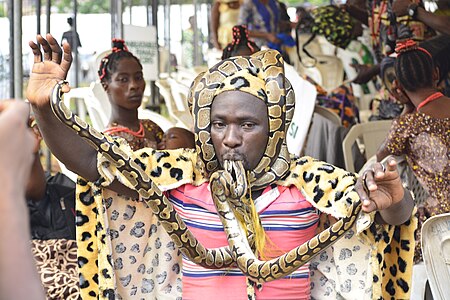 Magician dispalying with snake during Festival by Agbebiyi Adekunle Tadek