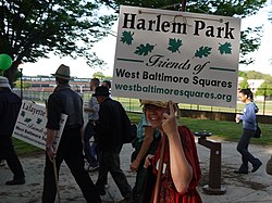 People gathered in Harlem Park, Baltimore (1500 block of Edmondson Avenue) for a walk through the area's squares and parks