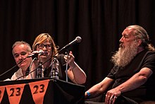 Michelle Olley, hosting talk with Adam Curtis and Alan Moore, at Cosmic Trigger play event, London 2017 (photo: Beccy Strong)
