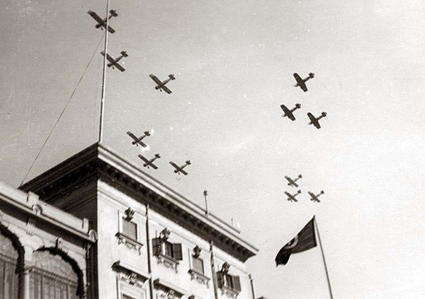 Egyptian airplanes flying over Koubbeh Palace in celebration of King Farouk I and Queen Farida's wedding.