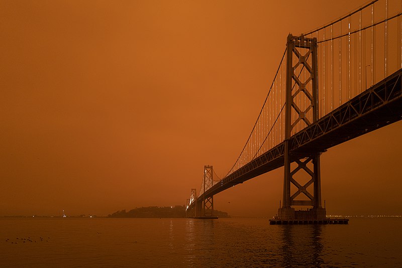 File:North Complex smoke in San Francisco - Bay Bridge partially illuminated and Yerba Buena Island.jpg