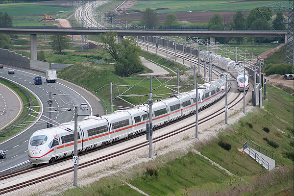 Two ICE 3-trains running on the Nuremberg–Ingolstadt high-speed railway, parallel to the BAB 9 near Greding