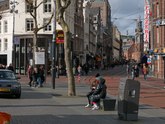 People are walking at the city square Rembrandtplein in Amsterdam downtown, on a sunny day in late winter; street photo by Fons Heijnsbroek, 19 February 2022.tif