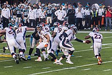 Peyton Manning handing the ball off to C. J. Anderson at Super Bowl 50 Peyton Manning handing off to C.J. Anderson Super Bowl 50.jpg