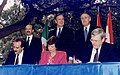 Image 42Three world leaders: (background, left to right) Mexican President Carlos Salinas de Gortari, U.S. President George H. W. Bush, and Canadian Prime Minister Brian Mulroney, observe the signing of the North American Free Trade Agreement. Commenced in San Antonio, Texas, on December 17, 1992. (from History of Mexico)