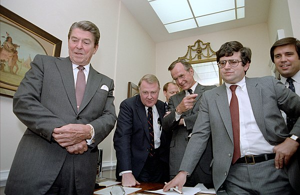 Duberstein with President Reagan watching the Tax Bill vote with staff in the White House, 19 August 1982