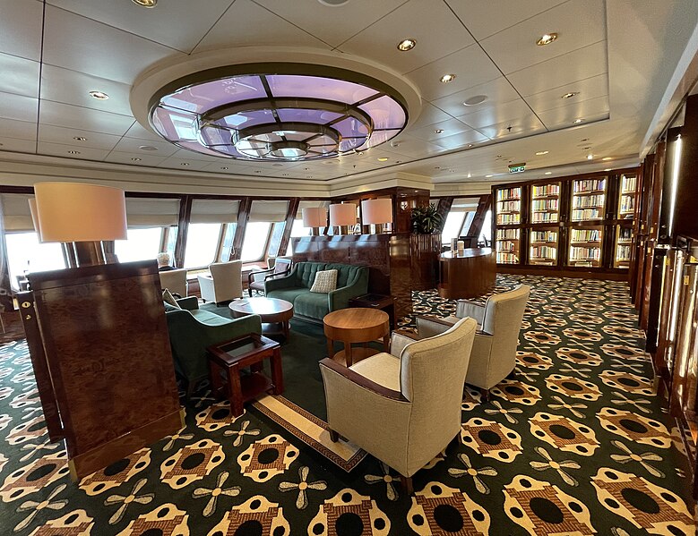File:Queen Mary 2, the extensive library also has a reading area overlooking the bow of the ship.jpg