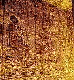 Ramesses offering to seated god Ptah. Frieze inside the Small Temple.