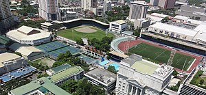 The Rizal Memorial Sports Complex, Manila. Center left and below the baseball field is the Rizal Memorial Tennis Center with the Rizal Memorial Coliseum indoor venue adjacent to the outside tennis courts this was the location of this tournament. Rizal Memorial Sports Complex birdseye.jpg